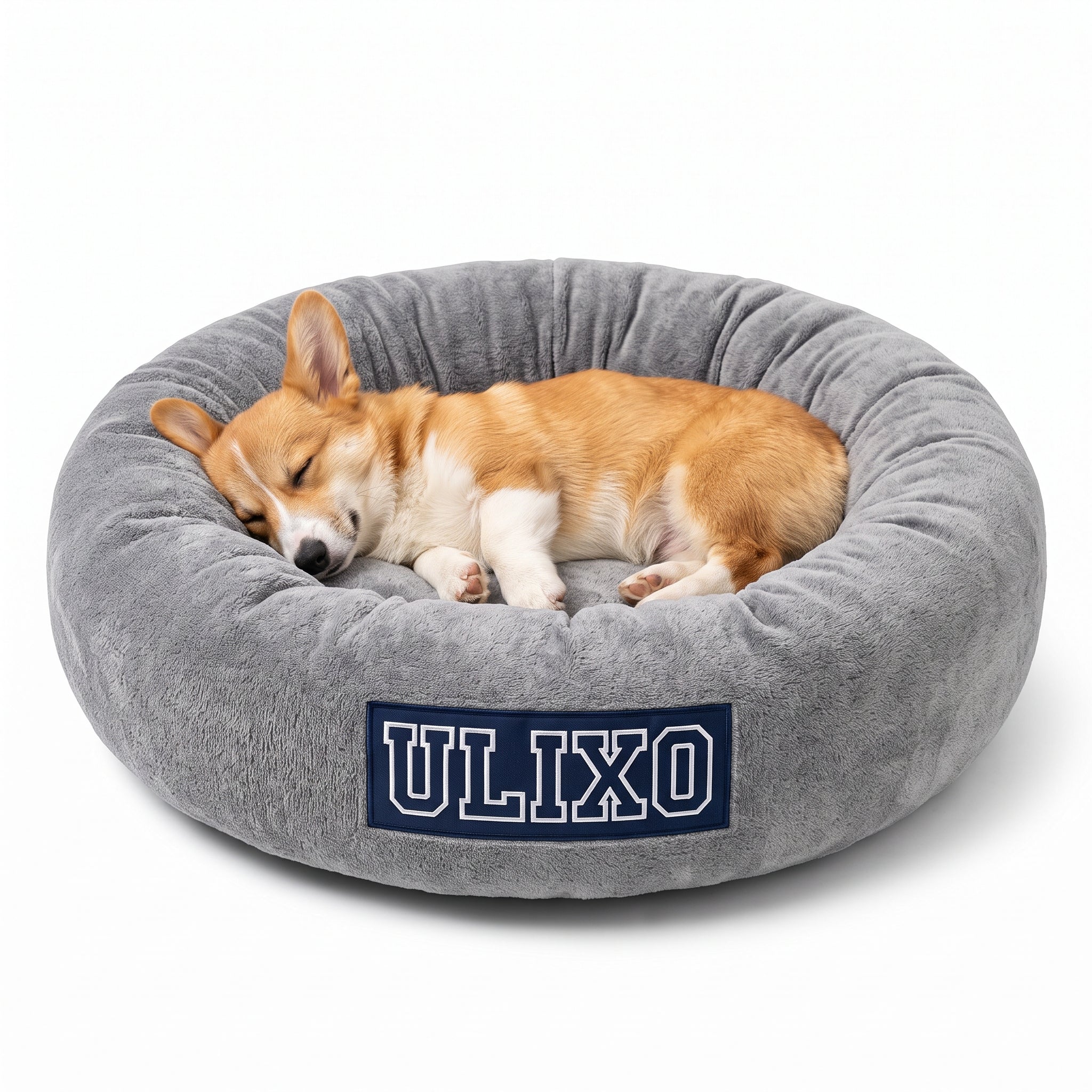 Corgi asleep in the Exclusive Ulixo VIP Pet Bed, heather grey with a navy ULIXO patch