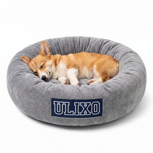 Corgi asleep in the Exclusive Ulixo VIP Pet Bed, heather grey with a navy ULIXO patch